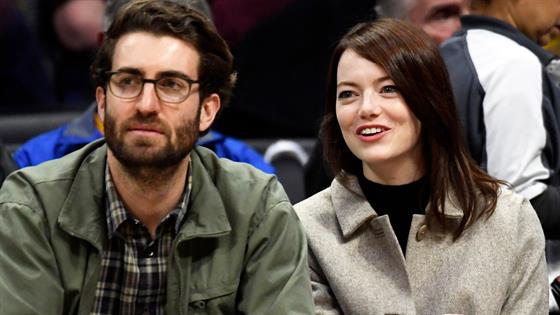 Emma Stone cradles baby bump as pregnancy is revealed