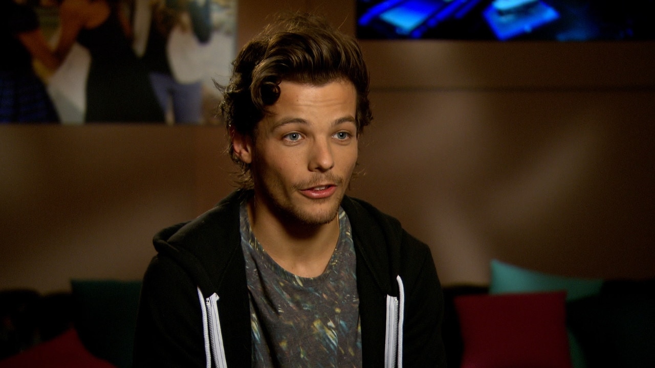 Louis Tomlinson Quizzed on 1D Fame | E! News