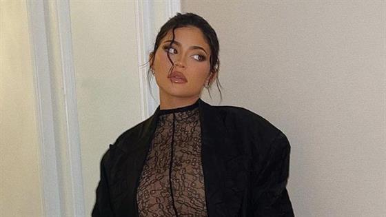 Kylie Jenner bares bump in sheer lace jumpsuit at NYFW