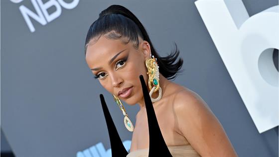 Doja Cat's surgery scars are visible in these photos. She has famously  admitted to her boob job (“I wish I could suck my own titties