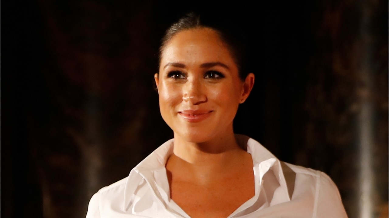 Meghan Markle Flaunts Baby Bump in Givenchy Business Wear | E! News